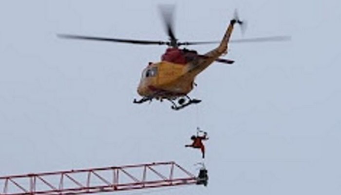 Royal Canadian Air Force CH-146 Griffon helicopter from 424 Transport and Rescue Squadron performed dramatic rescue of a crane operator who was trapped above a massive building fire 