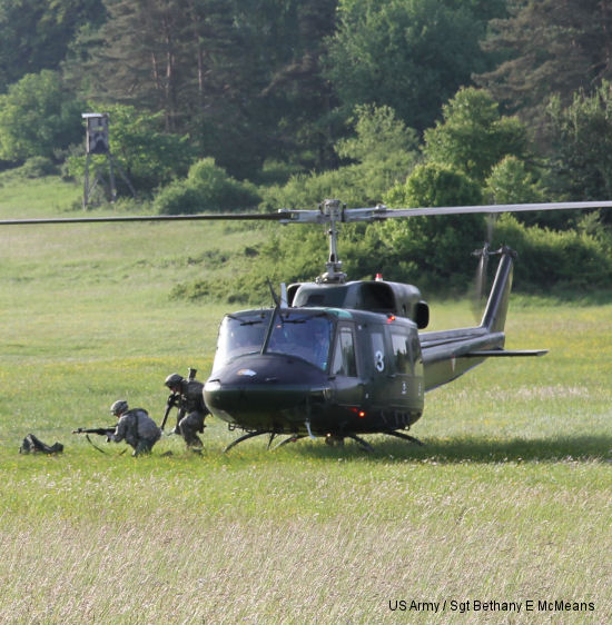 An Austrian AB.212 helicopter drops off Soldiers of the 1st Battalion, 182nd Infantry Regiment, Massachusetts National Guard, for an air assault exercise performed during Combined Resolve II at the Joint Multinational Training Command s Grafenwoehr and Hohenfels Training areas, May 15 - June 30, 2014. The exercise includes more than 4,000 participants from 15 allied and partner countries.