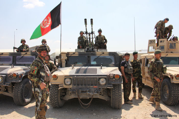Afghan National Army soldiers from 201 Corps prepare to move out at Tactical Base Gamberi