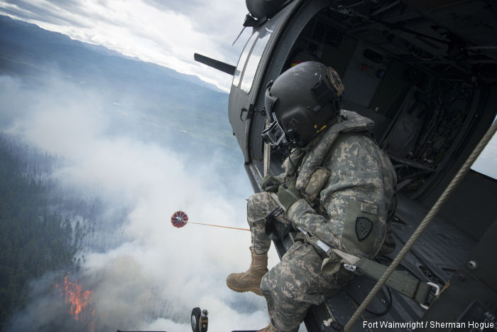 Alaska Army National Guard UH-60 Black Hawk helicopters from the 1st Battalion, 207th Aviation Regiment, continue to conduct water bucket drops in support of wildfire suppression efforts