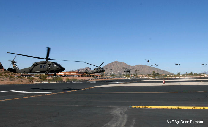 Twelve aircraft come in for landing during a training exercise at Papago Park Military Reservation.
