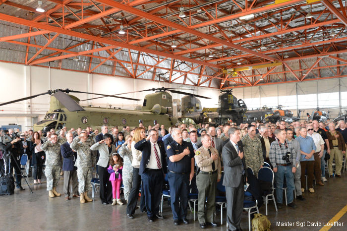 Attendees at an unveiling ceremony for the the California National Guard s new CH-47F Chinook helicopters stand for the national anthem in Stockton on Feb. 9.