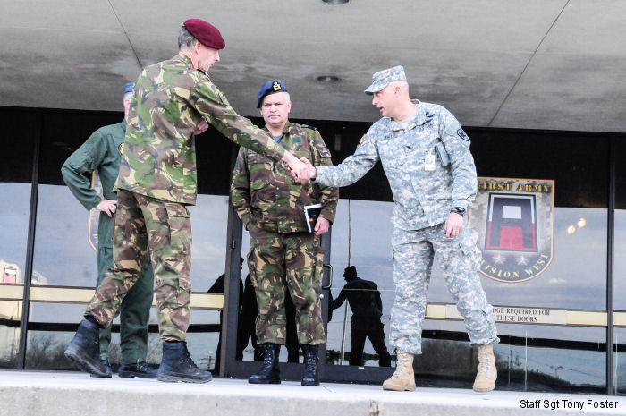 Col. John White, right, US 21st Cavalry Brigade commander, shakes hands with Dutch Brig. Gen. C.J. (Kees) Matthijssen, left, 11th Airmobile Brigade commander, and Air Commodore Jan Willem Westerbeek, center, Dutch Defense Helicopter Command on Fort Hood, Texas, January 29