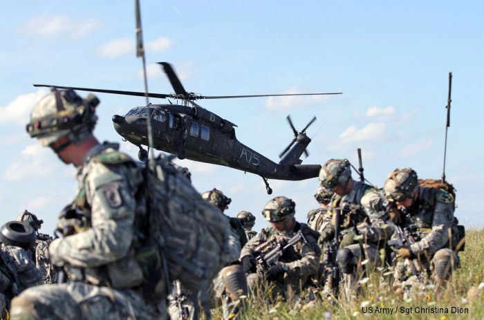 173rd Airborne Brigade paratroopers air assault through mock village during Saber Junction 14