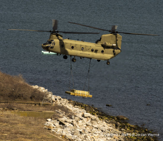 A CH-47 Chinook helicopter delivers a load of lumber to Great Gull Island, a 17-acre island in the Long Island Sound. The lumber was one of three deliveries made by Detachment 1, Company B, 2/104th Aviation from Groton to the island on April 25. More than 40 thousand pounds of lumber and supplies were airlifted to the island as part of an inter-agency environmental program with the American Museum of Natural History and the U.S. Fish and Wildlife Service.