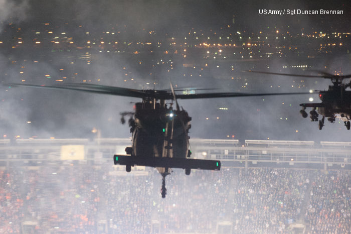 AH-64s and UH-60s from 101st Combat Aviation Brigade, 101st Airborne Division (Air Assault), approach Met Life Stadium as fireworks go off just prior to flying over the stadium in East Rutherford, N.J., Feb. 2, 2014