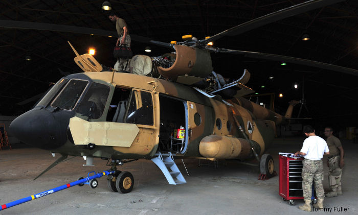 A team of aircraft maintenance technicians from the Afghan Special Missions Wing perform periodic repair functions on the Wing s Mi-17 helicopters in a maintenance facility at Kabul Hamid Karzia International Airport in order to sustain their aircraft.