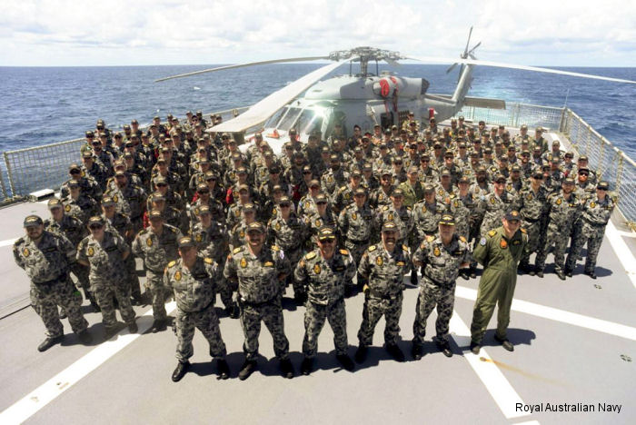 <a href=/database/unit/137/>HMAS Perth</a> ships company, <a href=/database/sqd/au_725_squadron/>NUSQN 725</a> and Aircraft Maintenance and Flight Trials Unit personnel at sea with the Royal Australian Navy s first Seahawk MH60R helicopter during First of Class Flight Trials.