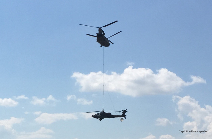 Texas Guardsmen sling load Apache helicopter with Chinook
