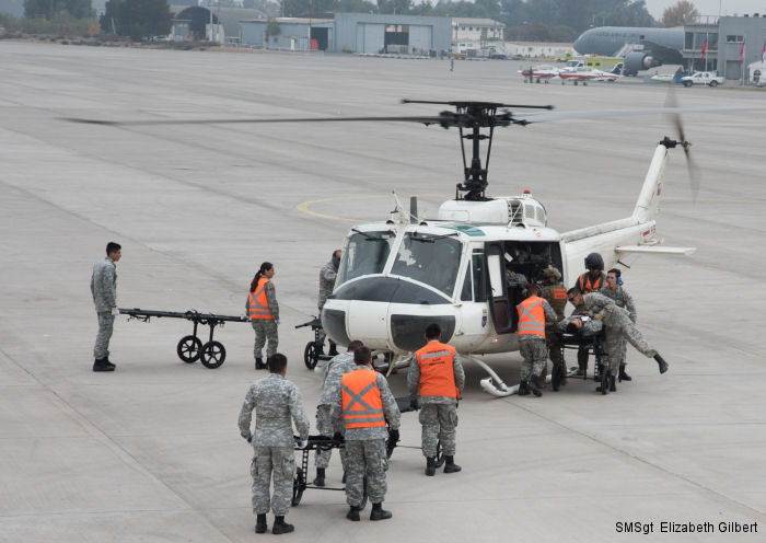 The Texas Air National Guard C-130H2 Hercules deployed to Chile for FIDAE participated in a medical air-evacuation exercise with a Chilean Air Force UH-1H Huey after the expo