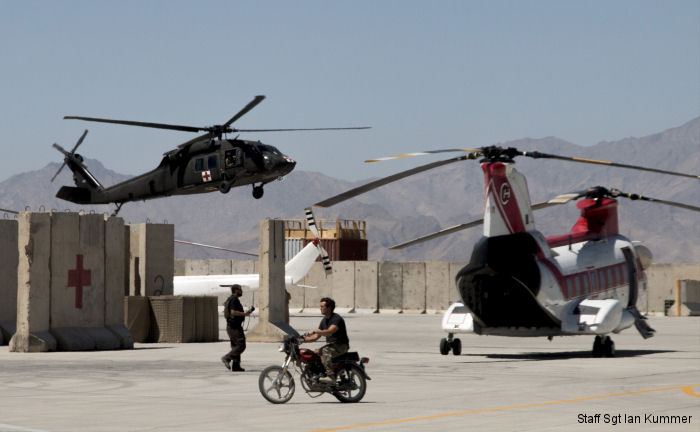 40th CAB HH-60M lands on FOB Dahlke, Afghanistan along side a <a href=/database/org/us_columbia_helicopters_international/>Columbia Helicopters</a> BV-107