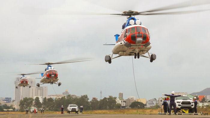 Southern Vietnam Helicopter Company (VNH South) Mi-172 cargo sling 3 Toyota pickup trucks for the British television automobile series Top Gear at the Vung Tau airport. Was filmed from VNH’s EC155B1