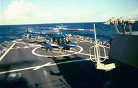 An Air Center Helicopters Bell 407 sits on the deck of the USS Cole. This 407 was the first to land on the USS Cole since it returned to service following the attack in Yemen.